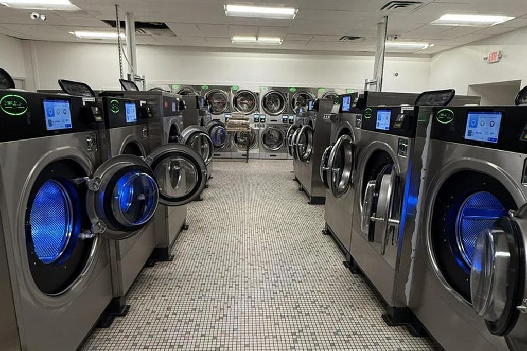Clean interior of a laundromat near Athens Ohio with commercial washers in a row