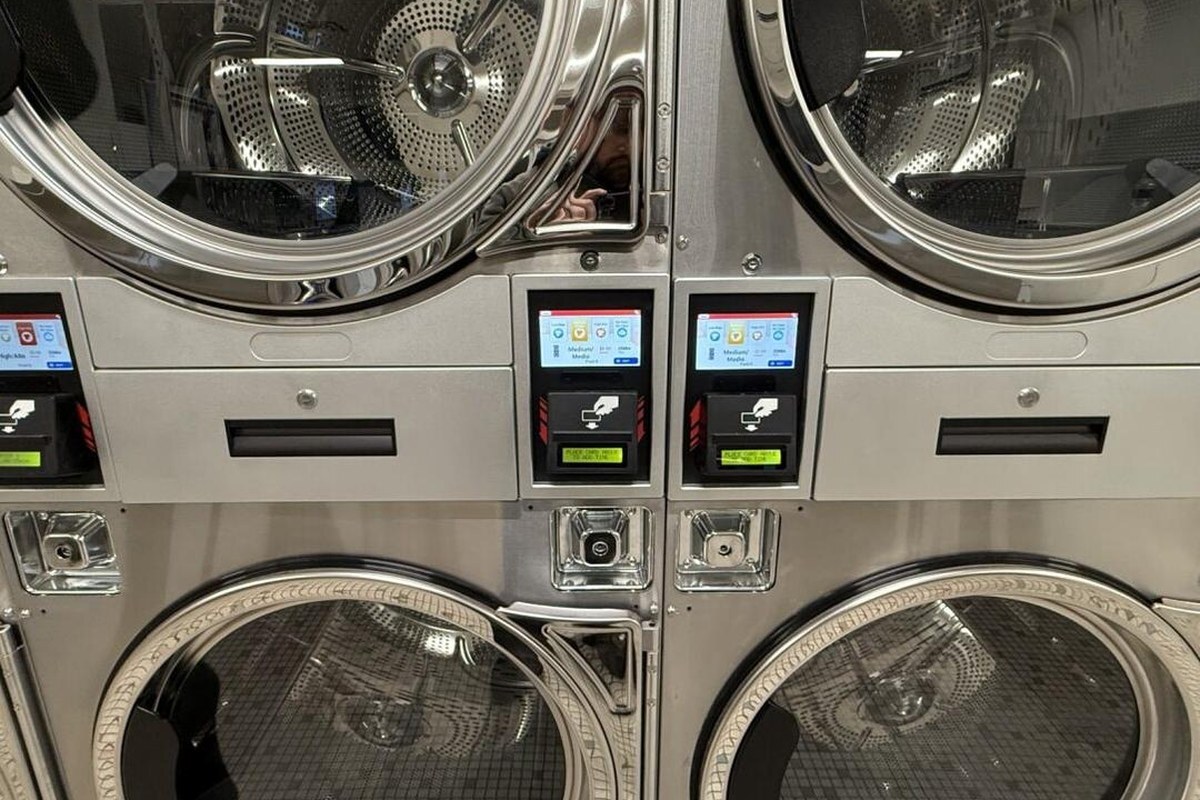 Bank of commercial dryers handling family-sized laundry loads in Nelsonville Ohio
